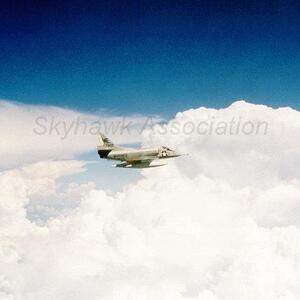 Blacksheep Skyhawk is pictured flying over the "tropic Q" clouds